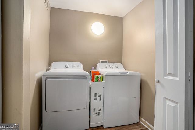 992 Brian Ln, Forest Park, GA 30297 - laundry area featuring independent washer and dryer and wood finished floors