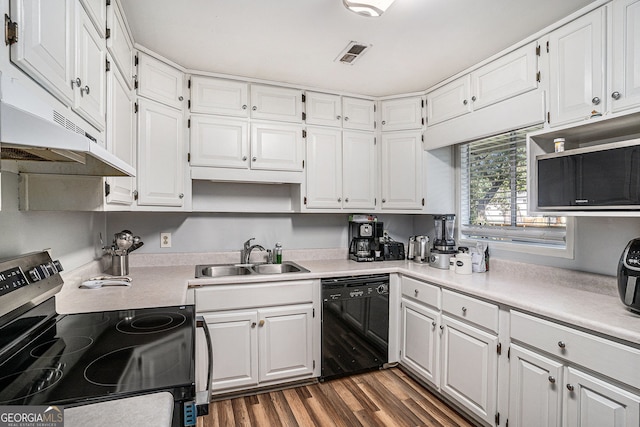 992 Brian Ln, Forest Park, GA 30297 - kitchen featuring dishwasher, stainless steel electric range oven, a sink, and white cabinetry
