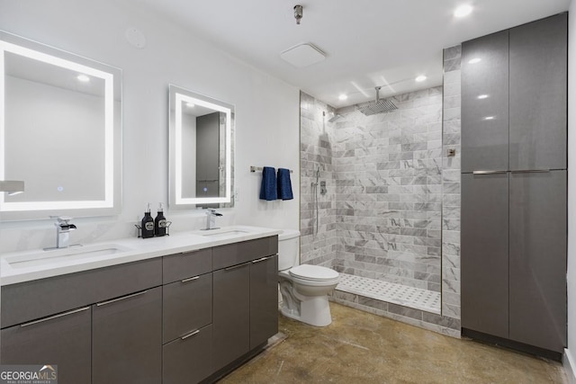 505 Whitehall St SW Unit 102, Atlanta, GA 30303 - bathroom featuring a tile shower, double vanity, recessed lighting, and toilet