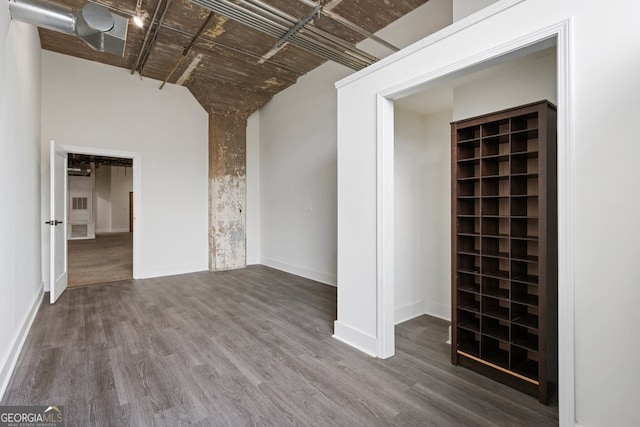 505 Whitehall St SW Unit 102, Atlanta, GA 30303 - unfurnished living room with wood finished floors and baseboards