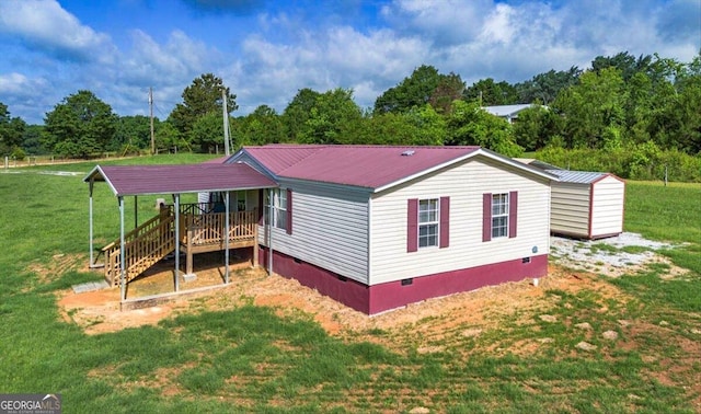 3350 Waggoners Grove Church Rd, Colbert, GA 30628 - view of side of home with crawl space, a lawn, and metal roof