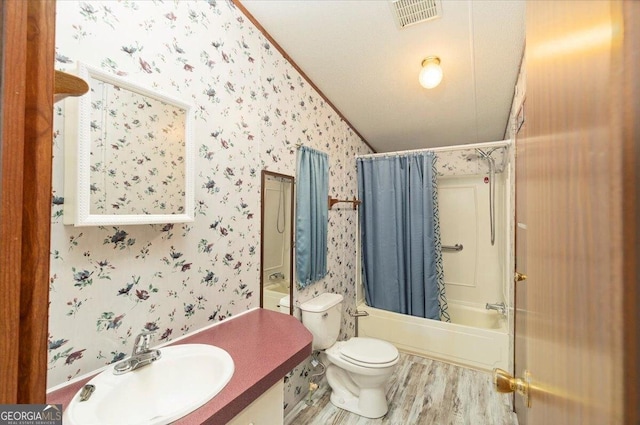 3350 Waggoners Grove Church Rd, Colbert, GA 30628 - bathroom with wallpapered walls, wood finished floors, shower / bath combination with curtain, toilet, and vanity