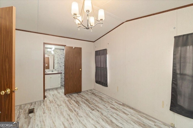 3350 Waggoners Grove Church Rd, Colbert, GA 30628 - unfurnished room featuring lofted ceiling, crown molding, light wood-style flooring, and a chandelier