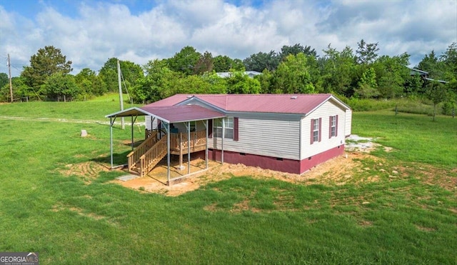 3350 Waggoners Grove Church Rd, Colbert, GA 30628 - back of property featuring crawl space, a lawn, and metal roof