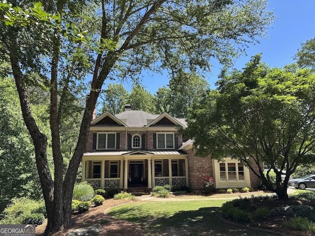 245 River Laurel Way, Woodstock, GA 30188 - view of front of house with a porch, brick siding, a chimney, and a front yard