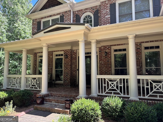 245 River Laurel Way, Woodstock, GA 30188 - property entrance with a porch and brick siding