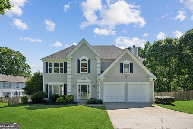 7025 Coffield Ct, Cumming, GA 30041 - colonial inspired home with a chimney, driveway, stucco siding, and roof with shingles