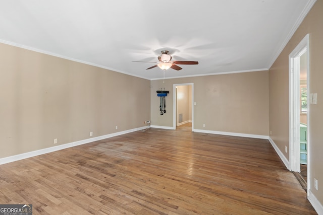 2933 King Alfred Dr, Macon, GA 31204 - unfurnished room with ceiling fan, wood finished floors, crown molding, and baseboards
