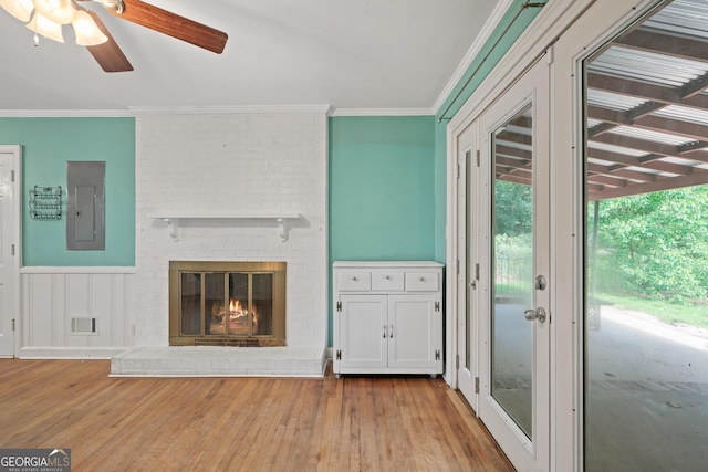 2933 King Alfred Dr, Macon, GA 31204 - unfurnished living room with electric panel, wood finished floors, ceiling fan, crown molding, and a fireplace