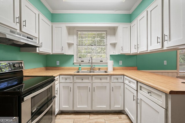 2933 King Alfred Dr, Macon, GA 31204 - kitchen featuring range with two ovens, a sink, open shelves, under cabinet range hood, and white cabinets