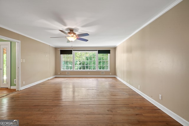 2933 King Alfred Dr, Macon, GA 31204 - spare room with ceiling fan, crown molding, wood finished floors, and baseboards