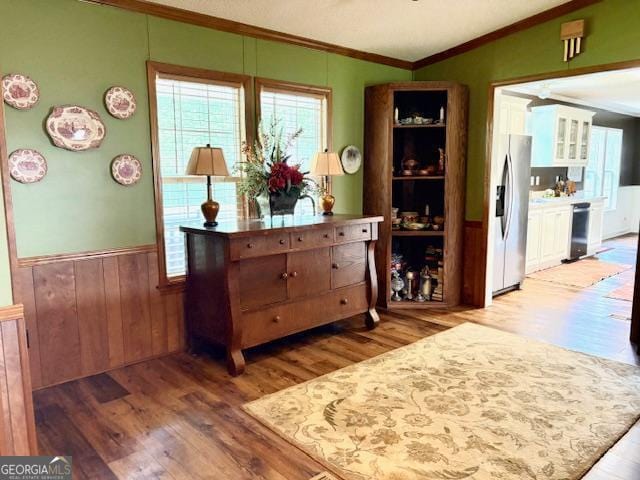 210 Vineyard Rd, Thomaston, GA 30286 - dining area featuring crown molding, wood finished floors, a wainscoted wall, and plenty of natural light