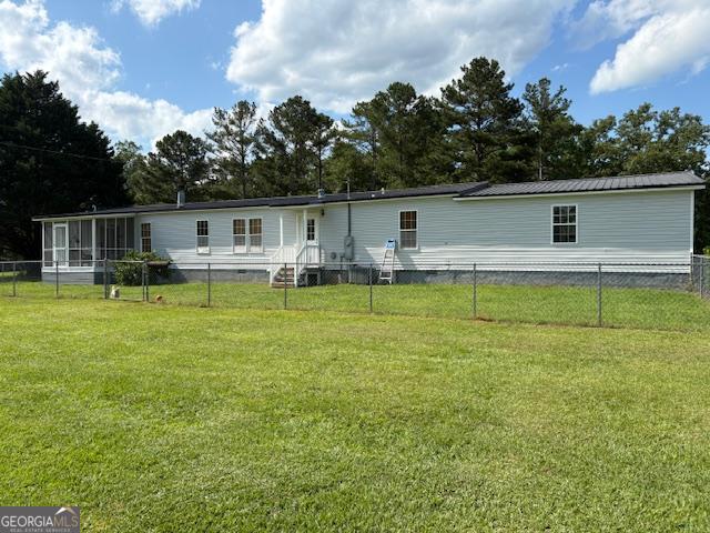 210 Vineyard Rd, Thomaston, GA 30286 - back of house with a sunroom and view of scattered trees
