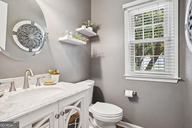 960 Pebblestone Ct, Alpharetta, GA 30009 - half bath featuring healthy amount of natural light, toilet, and vanity
