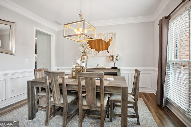 960 Pebblestone Ct, Alpharetta, GA 30009 - dining area with a chandelier, crown molding, dark wood-type flooring, wainscoting, and a decorative wall