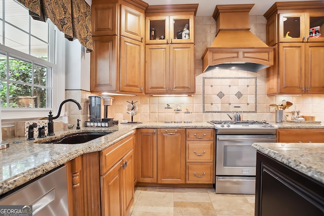 960 Pebblestone Ct, Alpharetta, GA 30009 - kitchen featuring stainless steel appliances, a sink, premium range hood, and light stone countertops