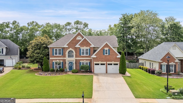 960 Pebblestone Ct, Alpharetta, GA 30009 - colonial inspired home featuring brick siding, concrete driveway, and a garage