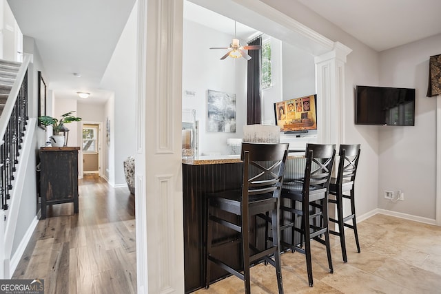 960 Pebblestone Ct, Alpharetta, GA 30009 - indoor bar featuring healthy amount of natural light, stairway, ceiling fan, and baseboards