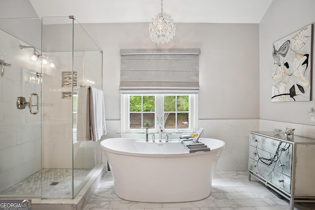960 Pebblestone Ct, Alpharetta, GA 30009 - bathroom featuring marble finish floors, a freestanding tub, a stall shower, a chandelier, and tile walls