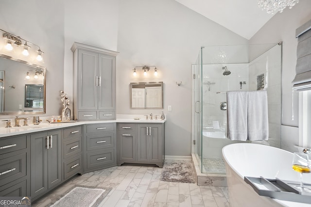 960 Pebblestone Ct, Alpharetta, GA 30009 - full bath with high vaulted ceiling, a shower stall, double vanity, marble look tile flooring, and a soaking tub