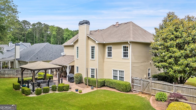 960 Pebblestone Ct, Alpharetta, GA 30009 - rear view of house with a gazebo, a patio, a shingled roof, and a chimney