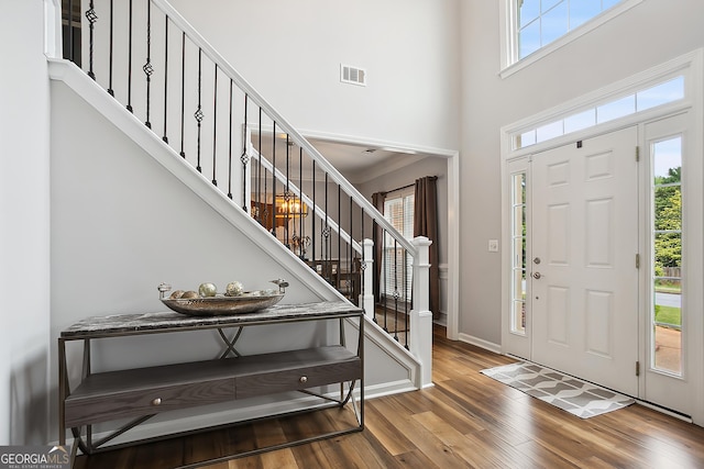 960 Pebblestone Ct, Alpharetta, GA 30009 - foyer with stairway, wood finished floors, healthy amount of natural light, a towering ceiling, and baseboards