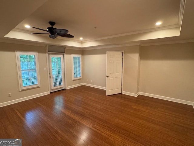 3047 Lenox Rd NE Unit 2105, Atlanta, GA 30324 - spare room featuring a tray ceiling, crown molding, ceiling fan, dark wood-style flooring, and baseboards