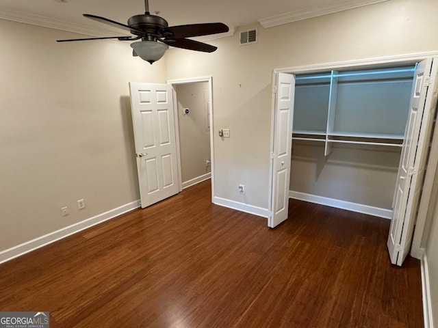3047 Lenox Rd NE Unit 2105, Atlanta, GA 30324 - unfurnished bedroom featuring ornamental molding, baseboards, wood finished floors, a closet, and a ceiling fan