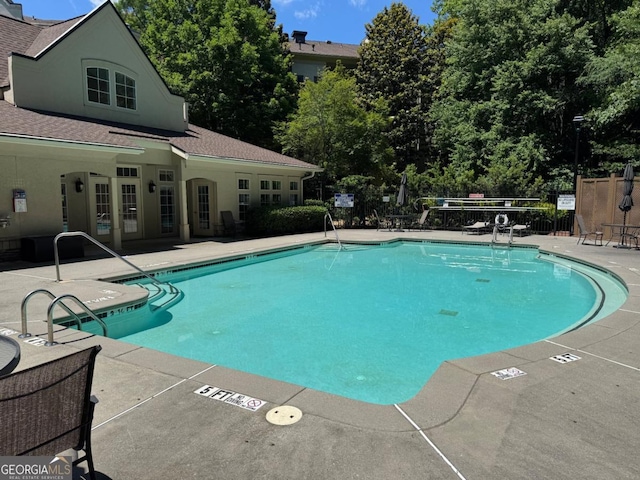 3047 Lenox Rd NE Unit 2105, Atlanta, GA 30324 - community pool featuring a patio
