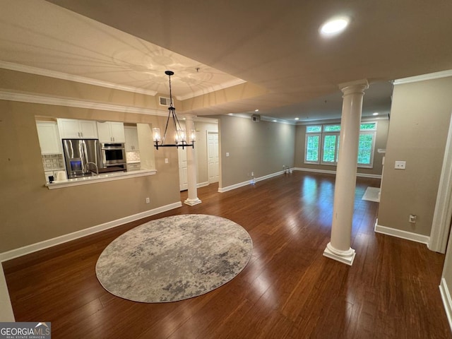 3047 Lenox Rd NE Unit 2105, Atlanta, GA 30324 - spare room featuring ornate columns, crown molding, dark wood-style flooring, baseboards, and recessed lighting