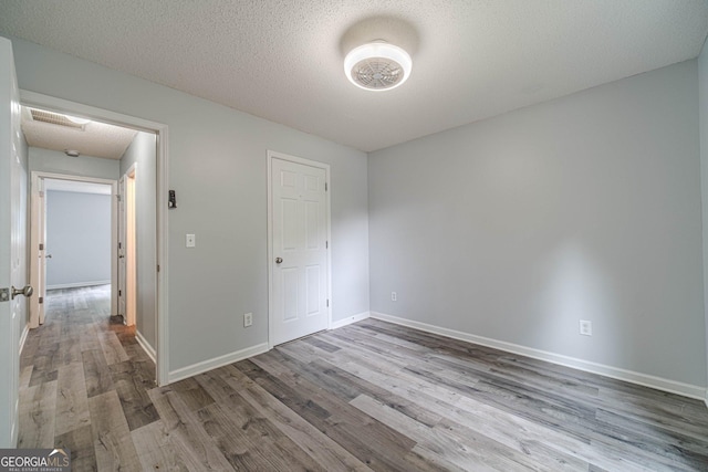 123 Chippewa Run, Auburn, GA 30011 - unfurnished bedroom featuring wood finished floors and baseboards