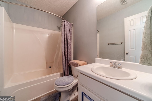 123 Chippewa Run, Auburn, GA 30011 - full bathroom featuring a textured ceiling, toilet, vanity, and shower / bathtub combination with curtain