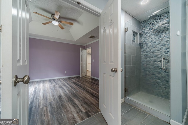 123 Chippewa Run, Auburn, GA 30011 - full bathroom with ceiling fan, a shower stall, crown molding, baseboards, and a textured ceiling