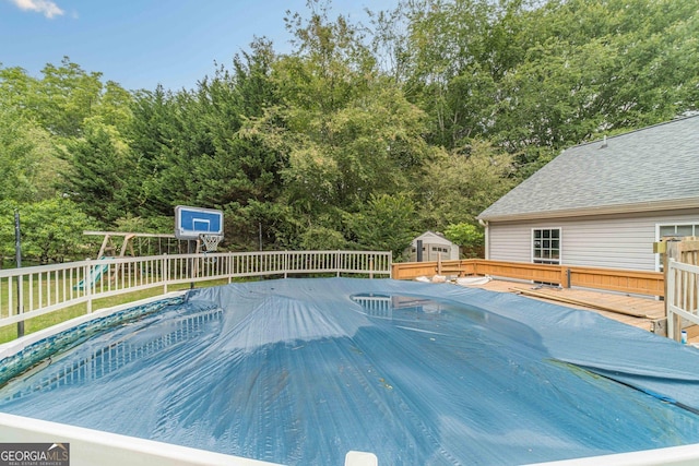 123 Chippewa Run, Auburn, GA 30011 - view of swimming pool with a deck, a playground, and view of wooded area