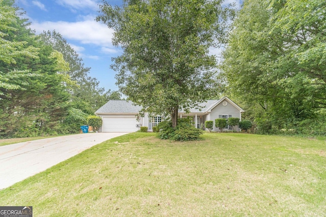 123 Chippewa Run, Auburn, GA 30011 - view of front of property with an attached garage, concrete driveway, and a front lawn