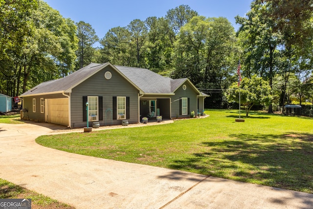 102 Fern Way, Thomaston, GA 30286 - view of front of house with driveway, a front yard, a porch, a carport, and view of wooded area
