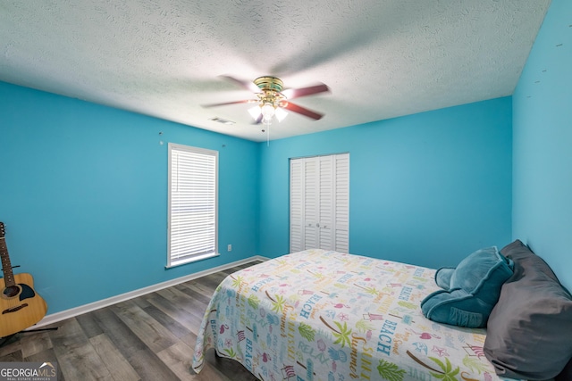 102 Fern Way, Thomaston, GA 30286 - bedroom featuring baseboards, wood finished floors, a ceiling fan, and a textured ceiling