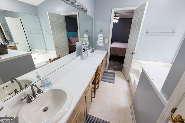 102 Fern Way, Thomaston, GA 30286 - bathroom featuring ensuite bath, double vanity, a ceiling fan, a bath, and tile patterned flooring
