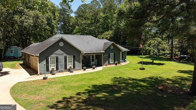 102 Fern Way, Thomaston, GA 30286 - view of front of home with concrete driveway, a front yard, and roof with shingles