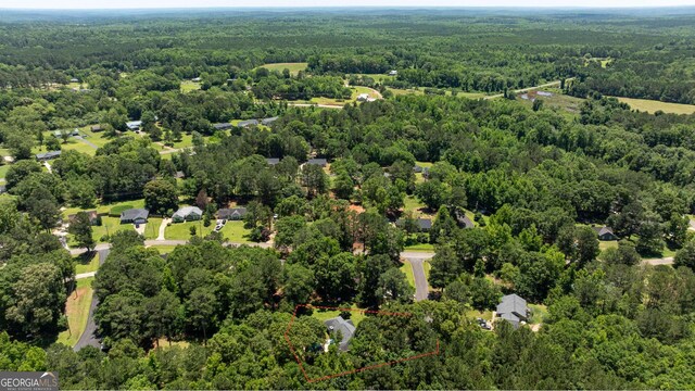 102 Fern Way, Thomaston, GA 30286 - aerial view of property and surrounding area featuring a heavily wooded area and property parcel outlined