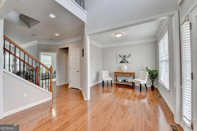 475 Bayswater Way, Suwanee, GA 30024 - living area with light wood-style flooring, stairs, crown molding, and recessed lighting