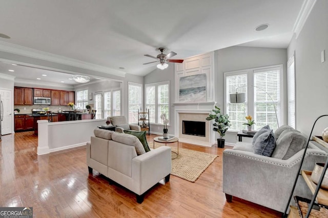 475 Bayswater Way, Suwanee, GA 30024 - living room with ceiling fan, ornamental molding, light wood finished floors, lofted ceiling, and a high end fireplace