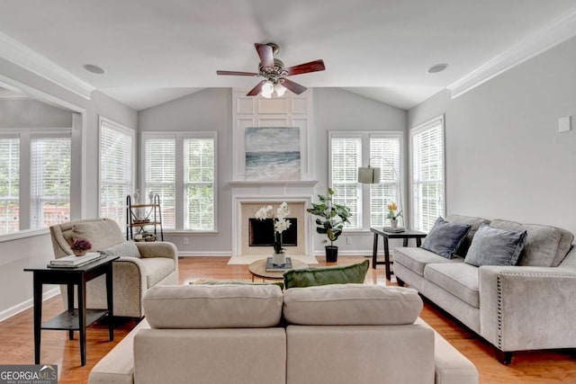 475 Bayswater Way, Suwanee, GA 30024 - living area with vaulted ceiling, plenty of natural light, a ceiling fan, light wood-style floors, and ornamental molding