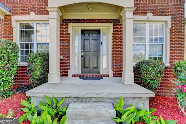475 Bayswater Way, Suwanee, GA 30024 - doorway to property featuring a porch and brick siding