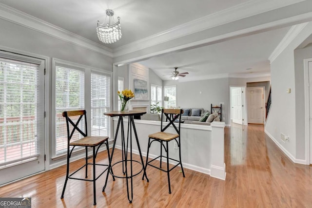 475 Bayswater Way, Suwanee, GA 30024 - dining area featuring light wood-style flooring, crown molding, a ceiling fan, and a chandelier
