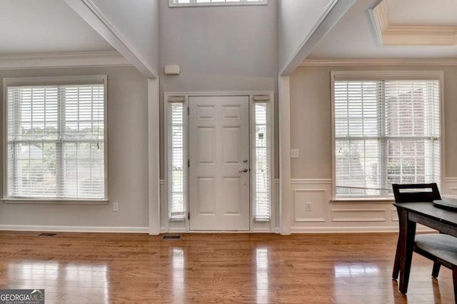 475 Bayswater Way, Suwanee, GA 30024 - entrance foyer featuring plenty of natural light, wood finished floors, wainscoting, and ornamental molding