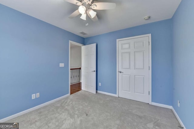 475 Bayswater Way, Suwanee, GA 30024 - unfurnished bedroom featuring carpet flooring and a ceiling fan