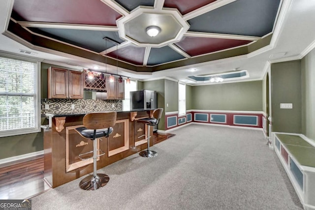475 Bayswater Way, Suwanee, GA 30024 - indoor bar featuring crown molding, a raised ceiling, decorative backsplash, hanging light fixtures, and stainless steel fridge with ice dispenser