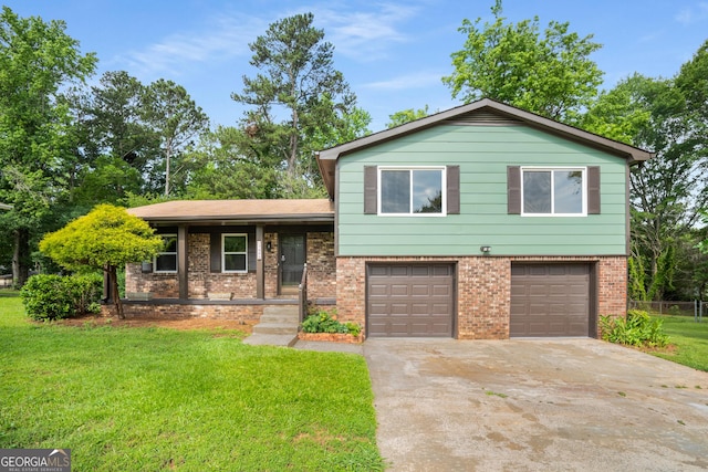 7455 Dover Ct, Riverdale, GA 30274 - split level home with an attached garage, concrete driveway, and brick siding