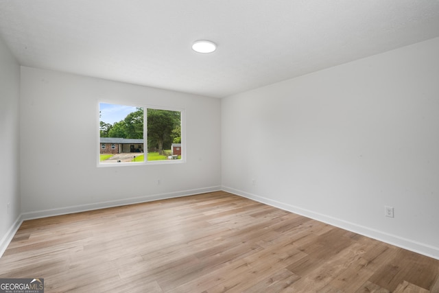 7455 Dover Ct, Riverdale, GA 30274 - unfurnished room featuring light wood-style flooring and baseboards